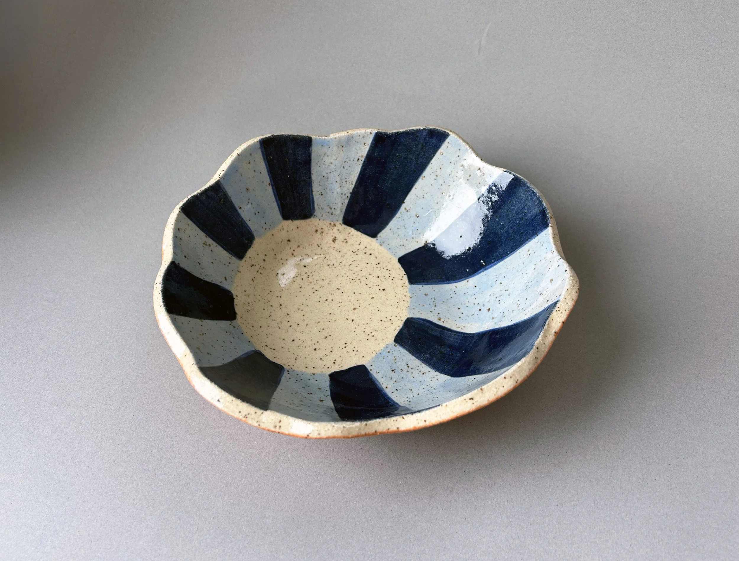 blue striped sunburst bowl orange stoneware.jpg