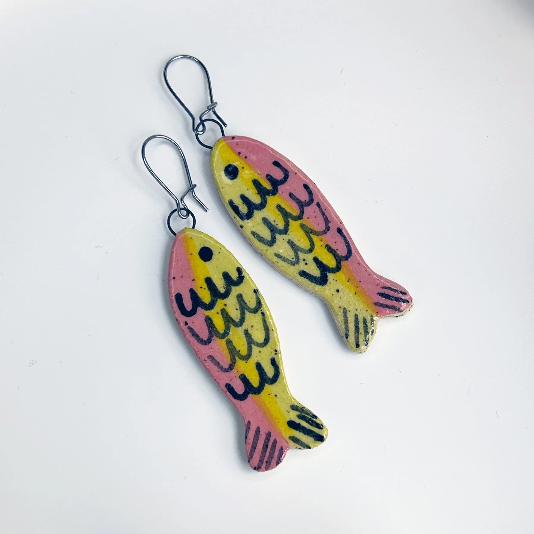 pink yellow fish dangle earrings.jpg