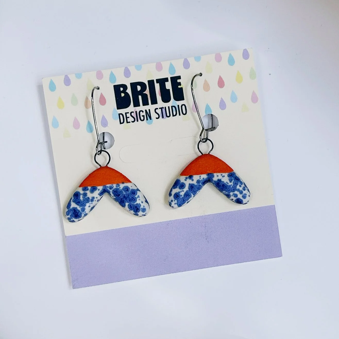 orange blue speckle dangle earrings.jpg