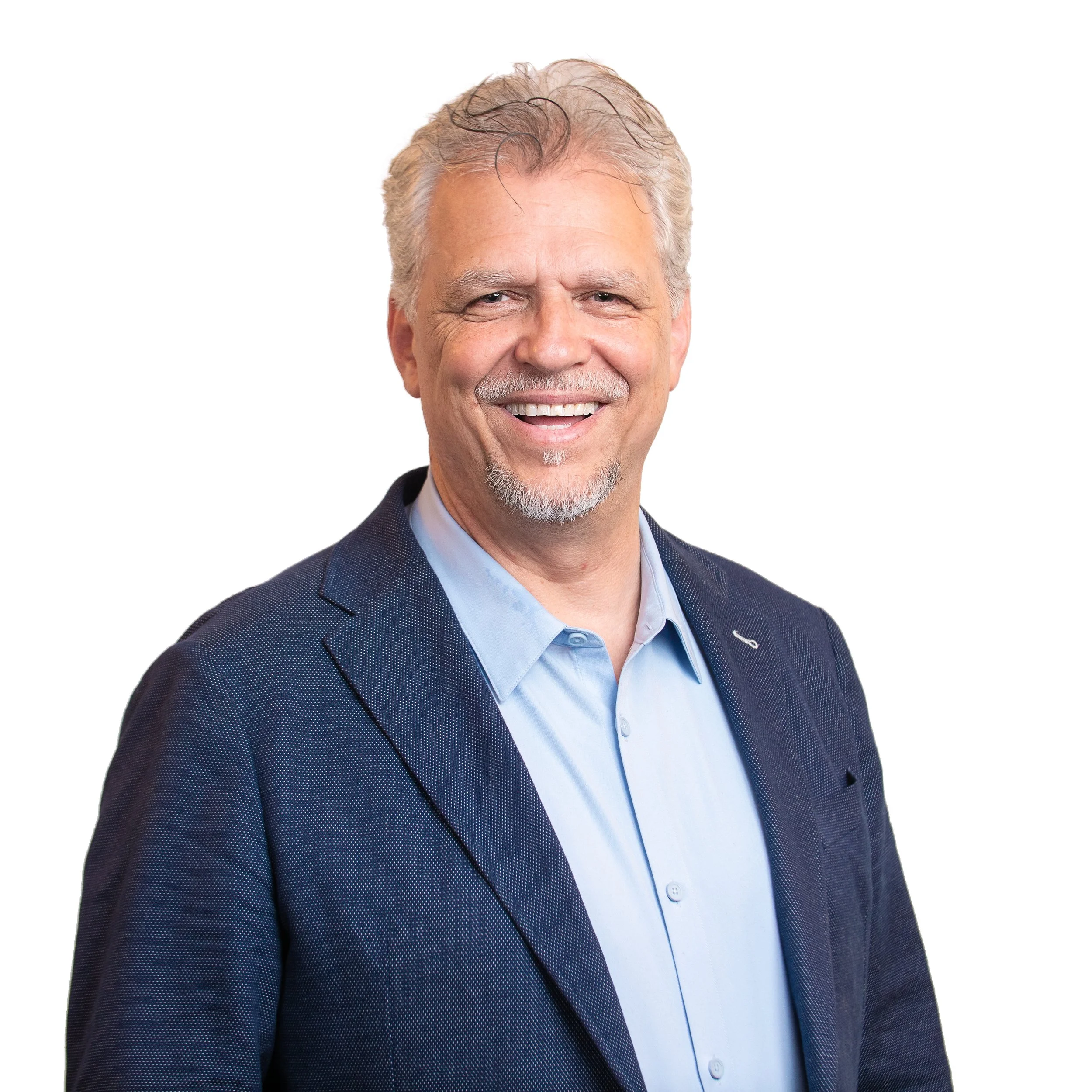 Photo of Shawn A. Saulnier, Strategic Advisor, Inception Oil & Gas Limited. Close-up of a smiling middle-aged man with gray hair, beard, and mustache dressed in a navy jacket and light blue shirt.