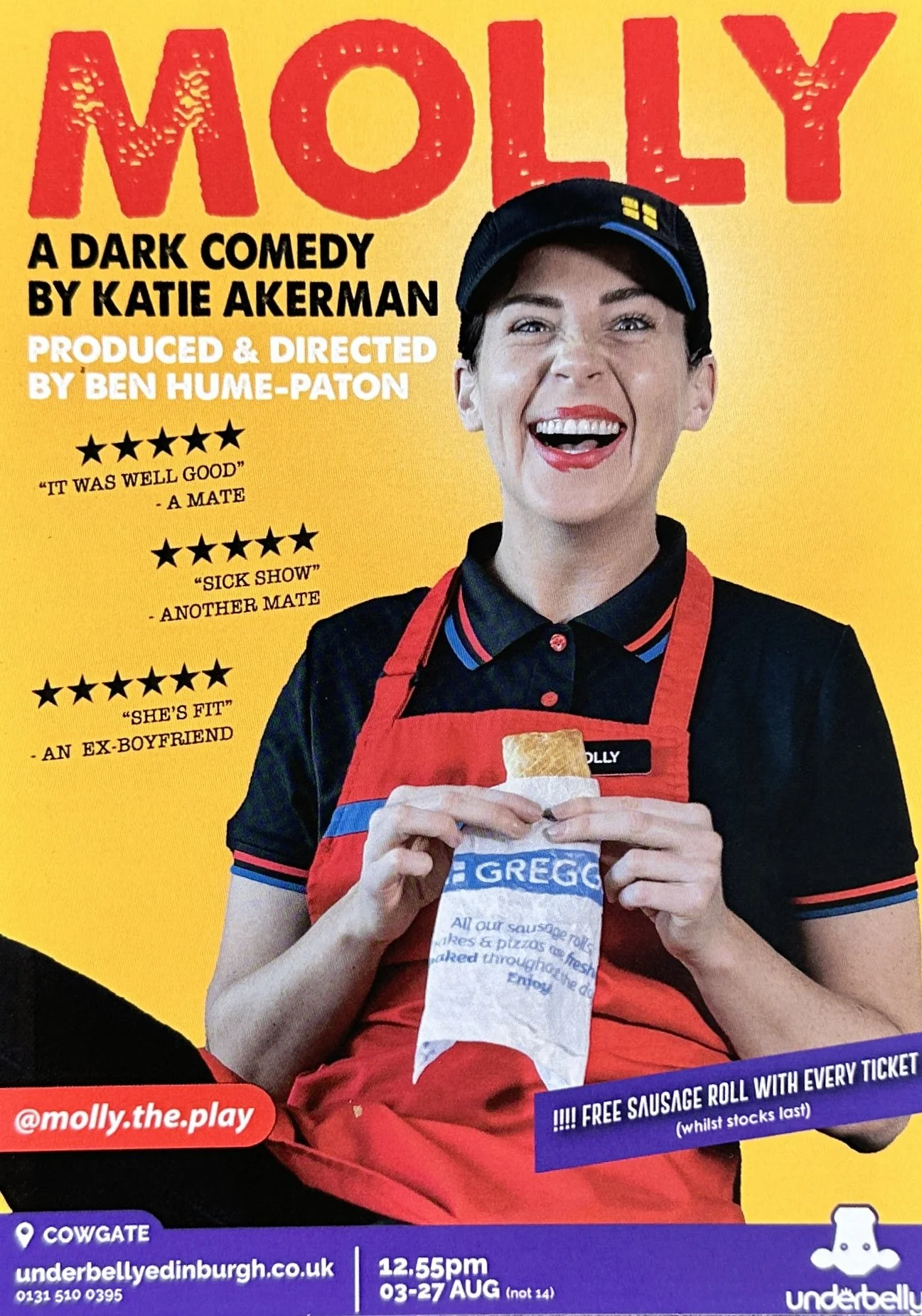 A smiling woman dressed as a fast-food worker holding a sausage roll in packaging with a yellow background promotional poster for a dark comedy play titled 'MOLLY' by Katie Akerman. The woman wears a black cap, black polo shirt with red and blue acce