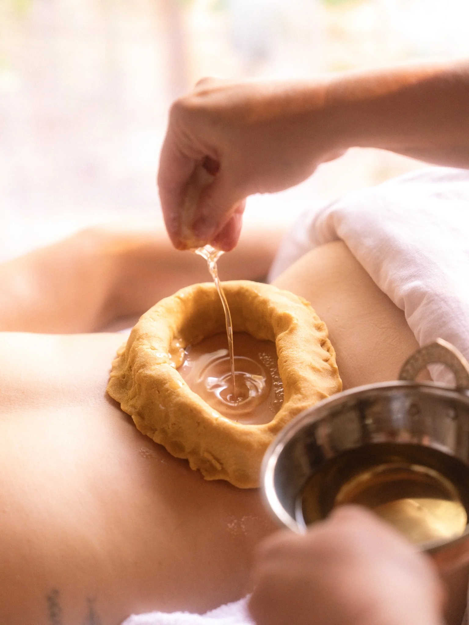 Ayurvedic Kati Basti herbal oil therapy in Ojai