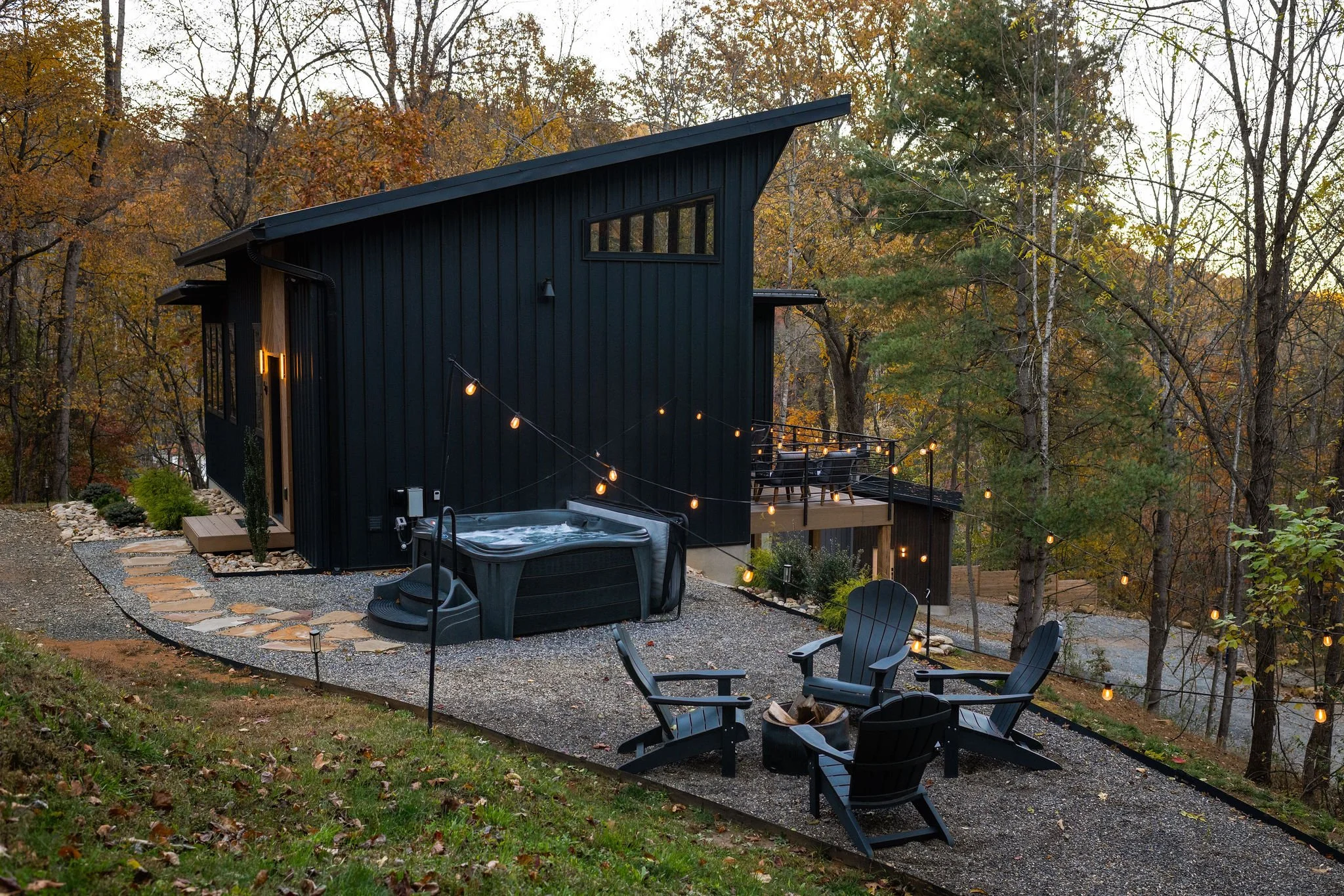 Scandinavian tiny house with hot tub and fire pit