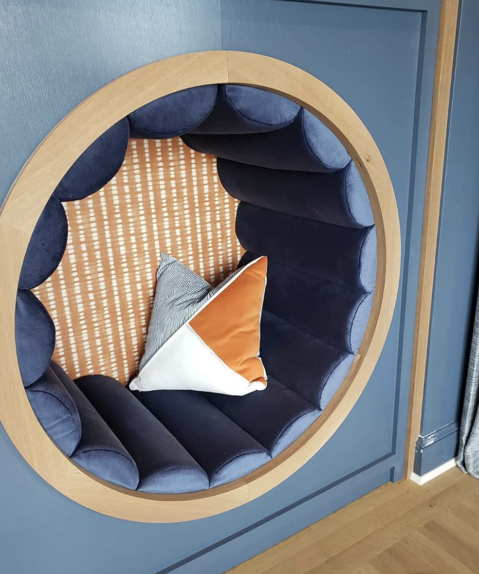 beautiful reading nook with blue velvet upholstery