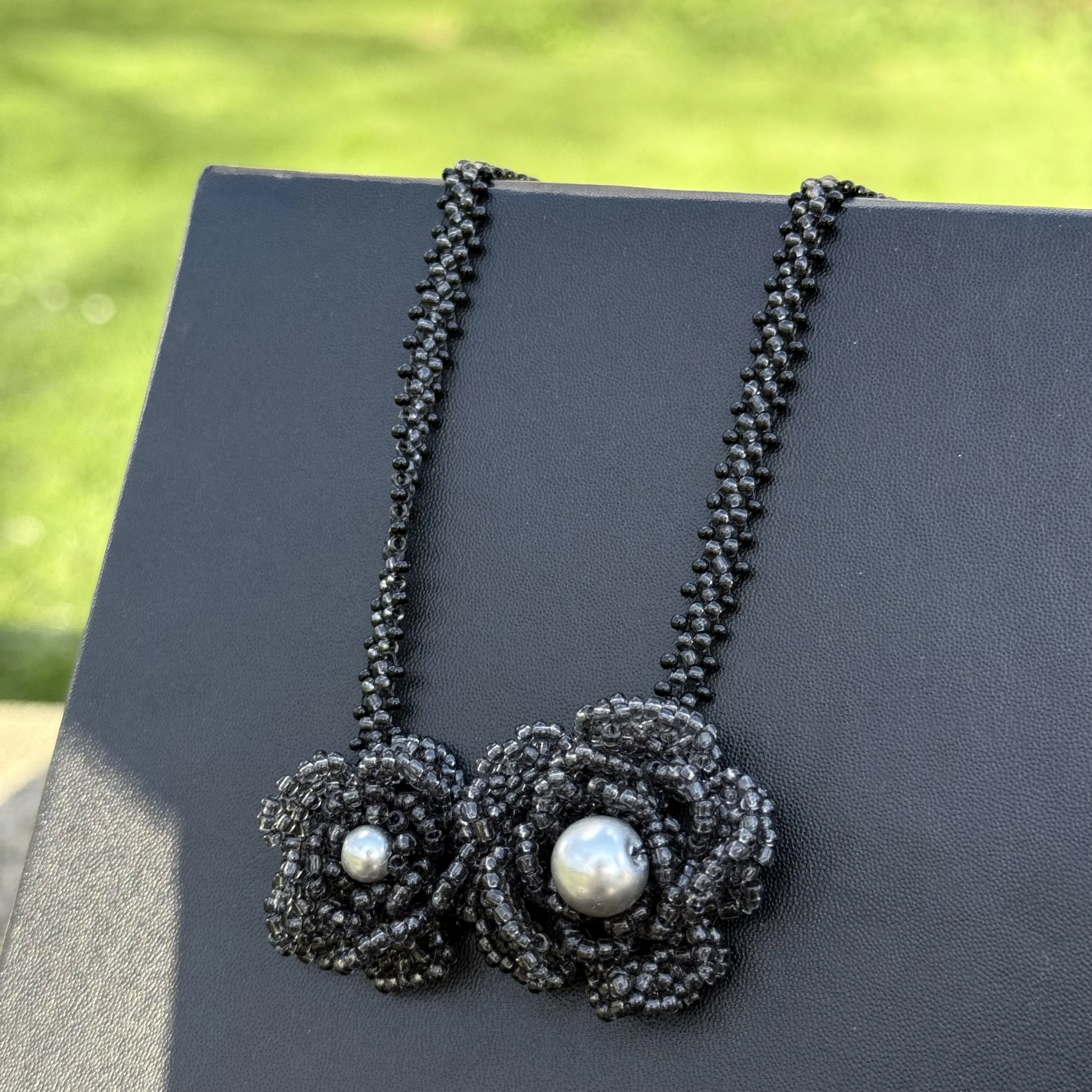 Elegant Black Beaded Floral Necklace with Silver-Tone Pearls