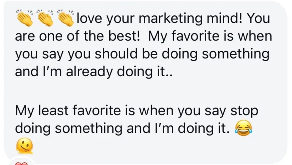 Screenshot of a text message with a motivational quote about marketing, including emojis of clapping hands, a laughing face, a sweating face, a thinking face, and a red heart.