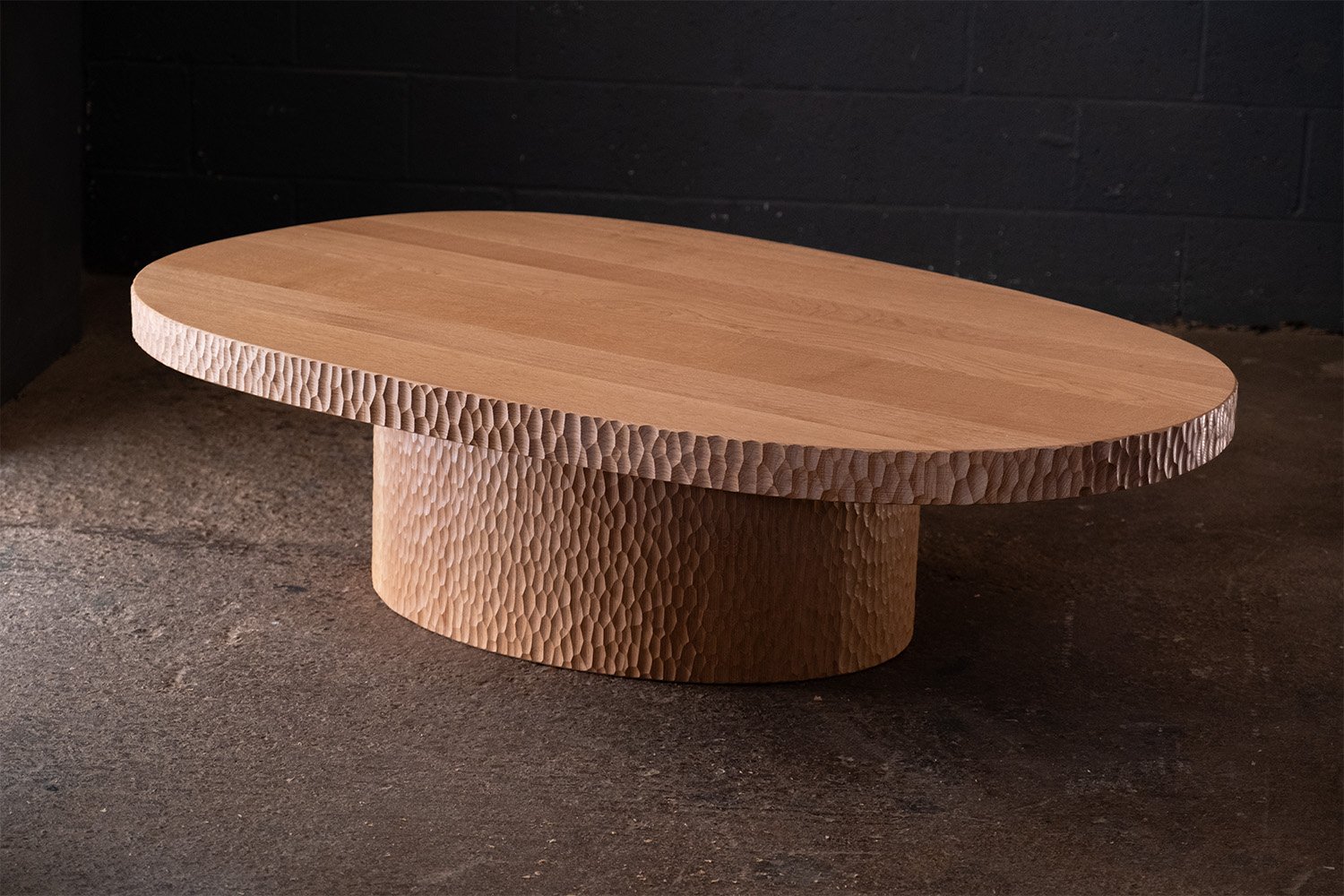Carved and textured coffee table in oak