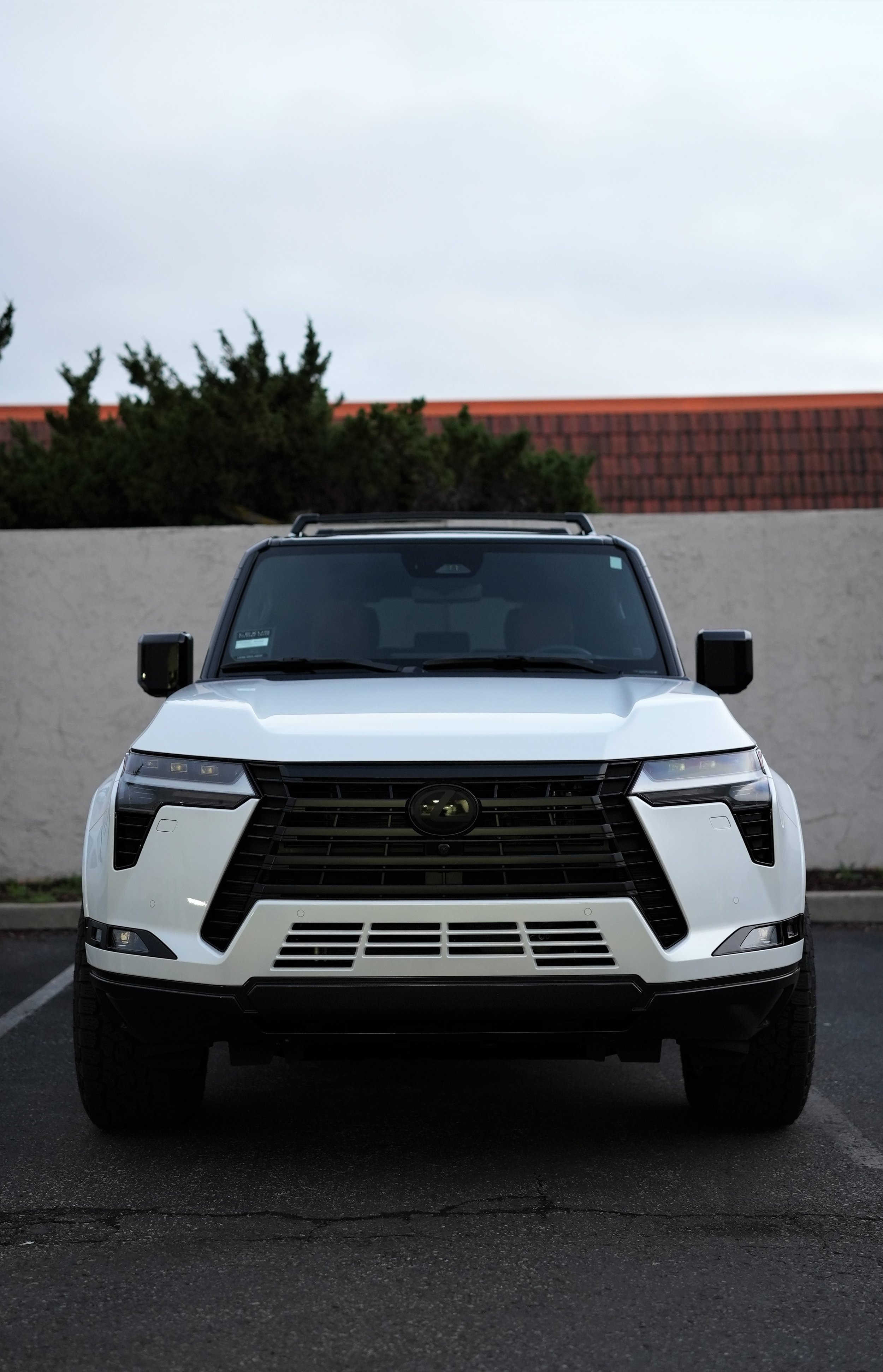 White pickup truck parked outdoors in Campbell, representing premium automotive styling and protection services including ceramic window tint, paint protection film, and ceramic coating by Enthusiast Auto Tint, serving luxury and daily-driven vehicle