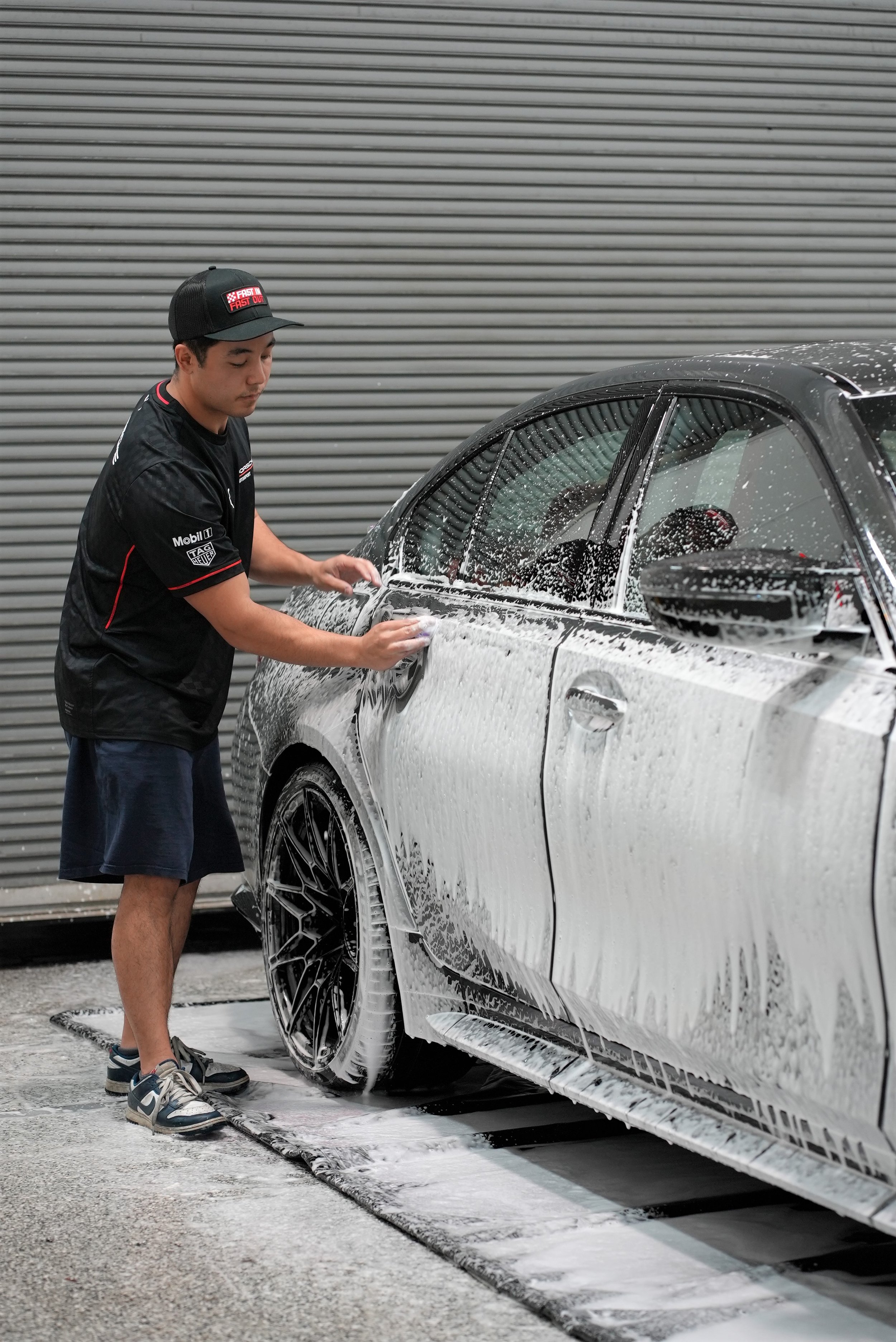 Luxury sports car detailing and wash process in Campbell, highlighting premium ceramic coating and paint protection services by Enthusiast Auto Tint.