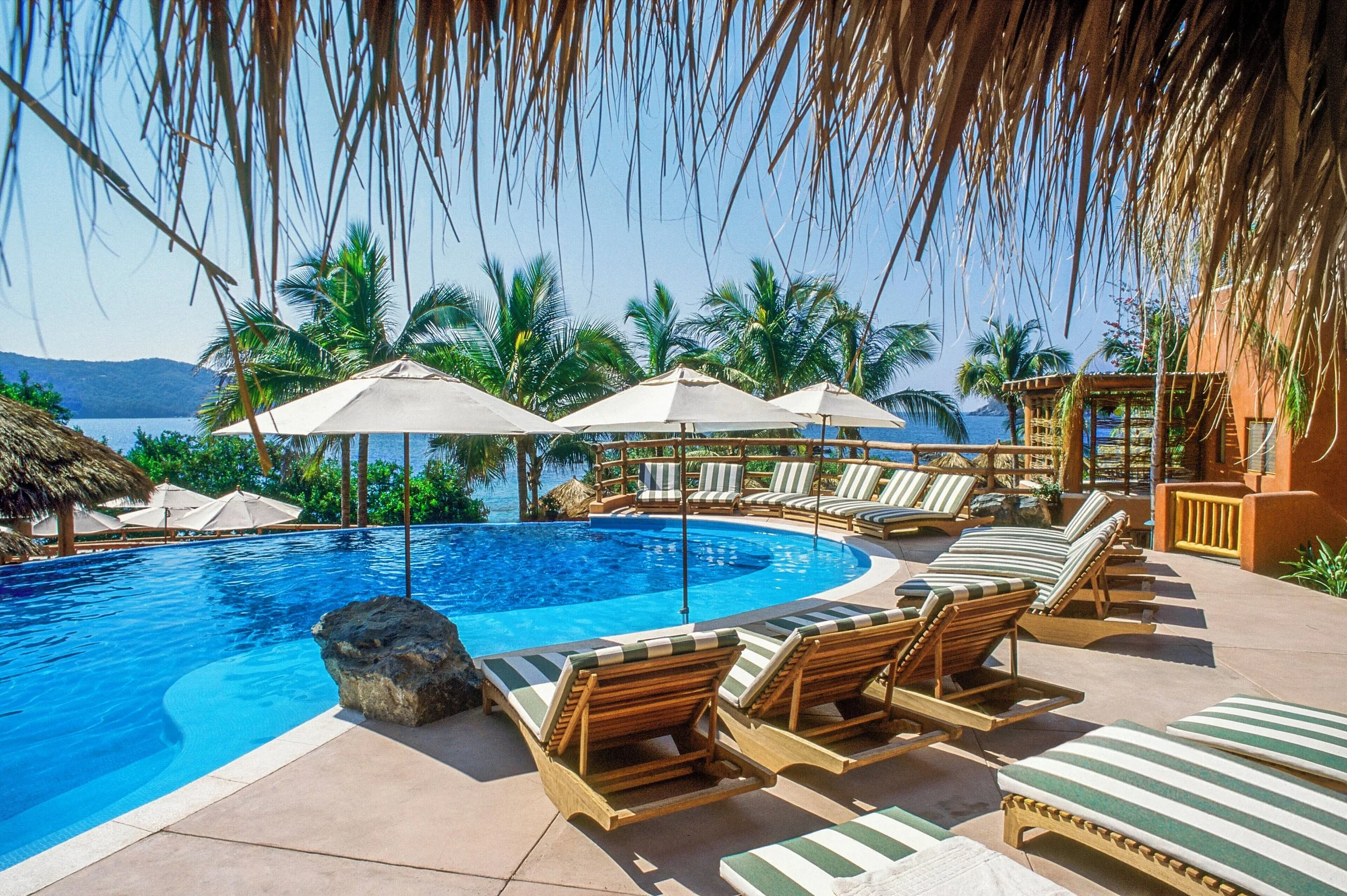 Hilton Grand Vacation Zihuatanejo updated info for booking poolside chairs over playa la ropa view