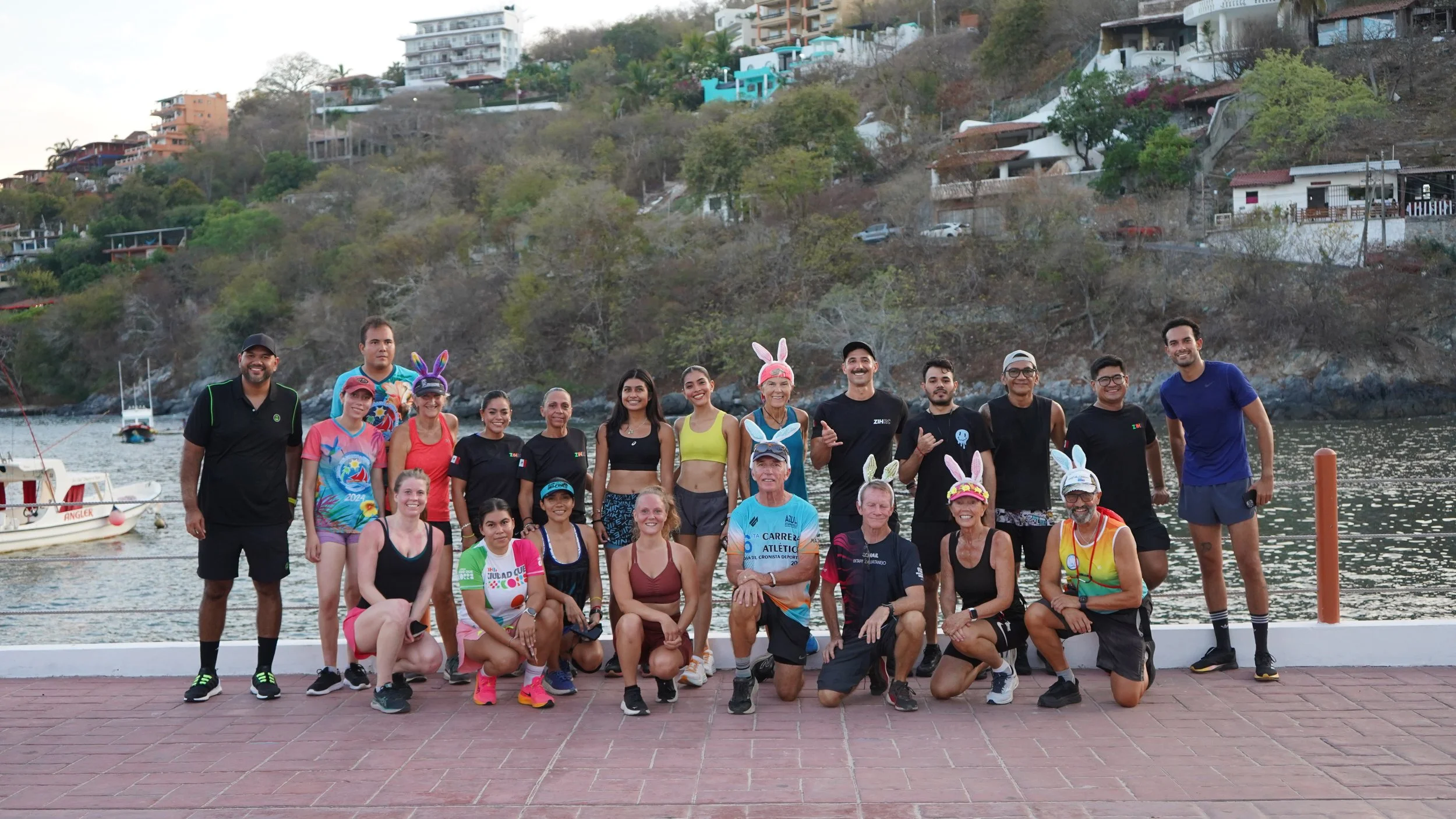 zihrc runners on muelle of zihuatanejo mexico posing for picture smiling
