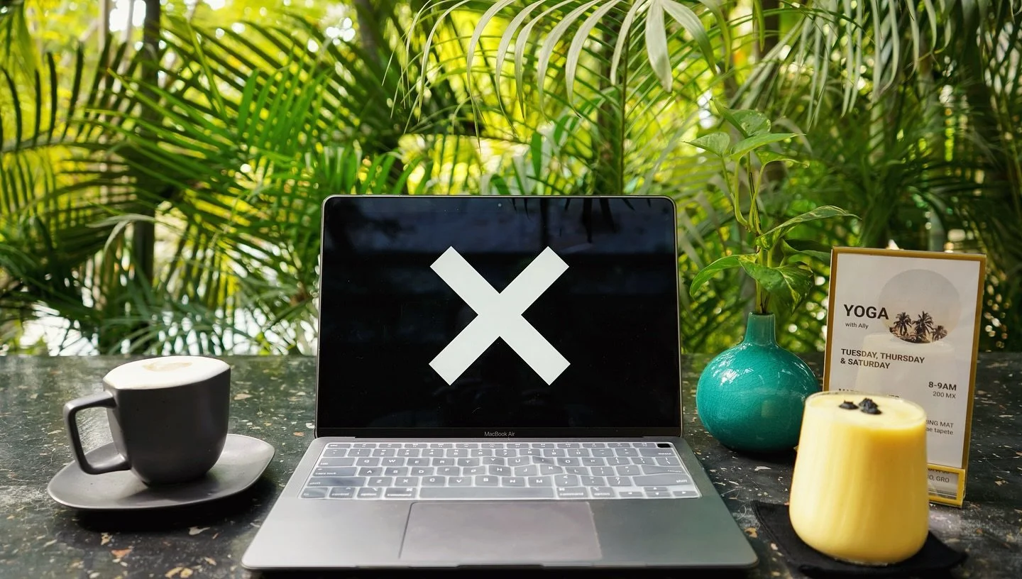 Computer with LOOT logo in Playa La Ropa, Zihuatanejo Mexico for digital nomad working.