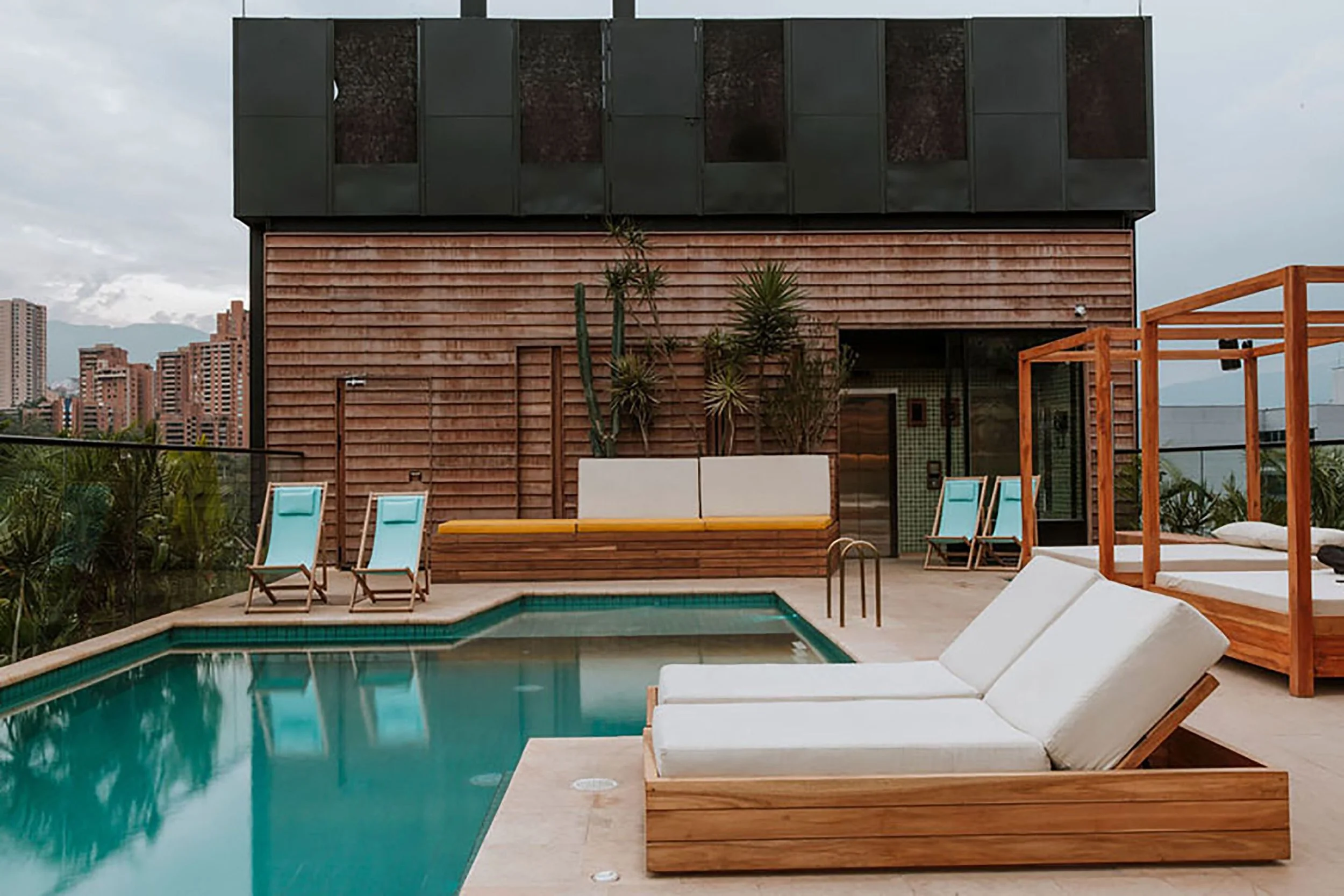 click clack hotel medellin colombia pool views modern industrial luxury