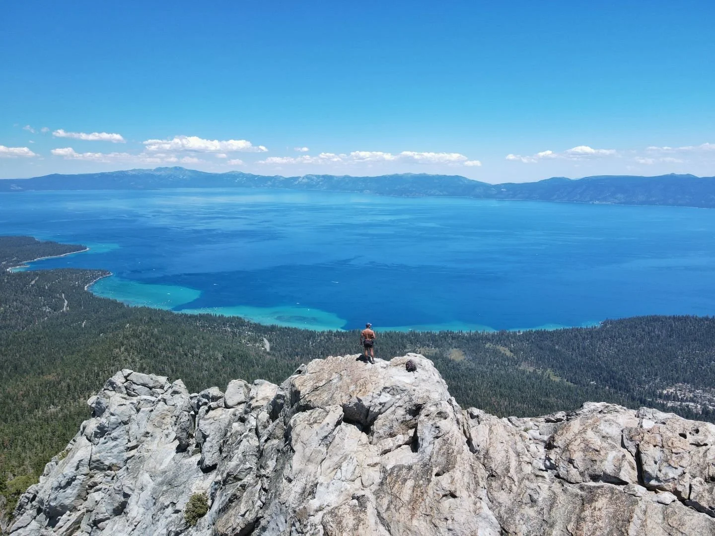 man on mountain lake tahoe overlook blue