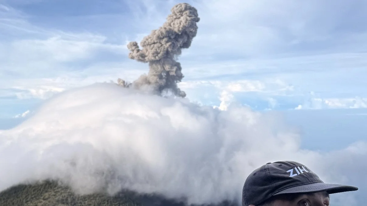 Volcán de Fuego ash eruption rising above the clouds, seen from Acatenango basecamp, Guatemala