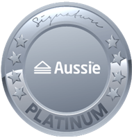 A silver-colored medal with the word 'Aussie' in the center, surrounded by stars and the words 'PLATINUM' at the bottom.