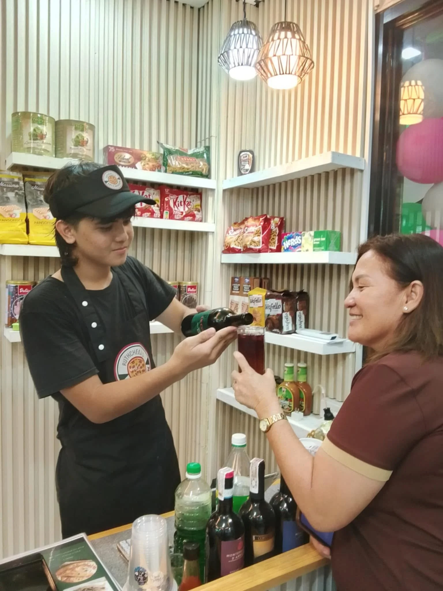 Ruthchell's Delicatessen Staff Serving Drinks