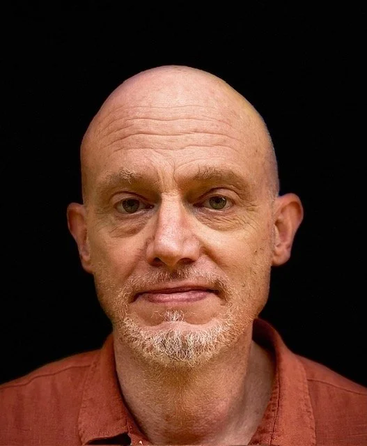 Tom smiling at the camera