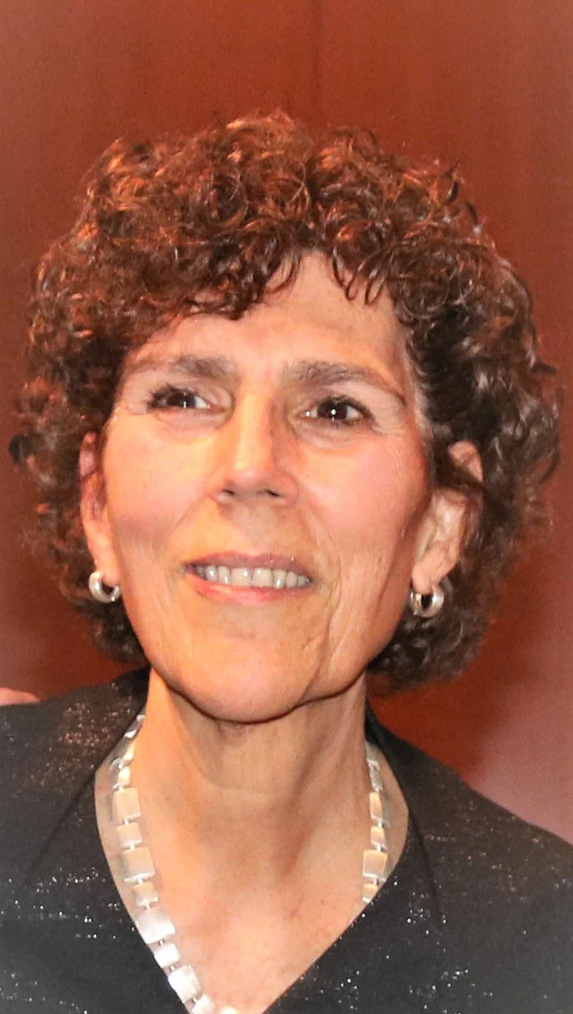 Paula smiling at the camera.