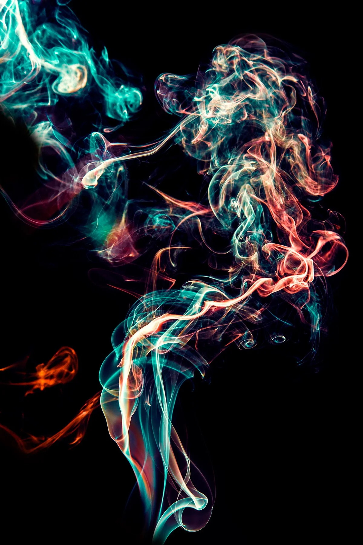 Colorful swirling smoke against a black background.