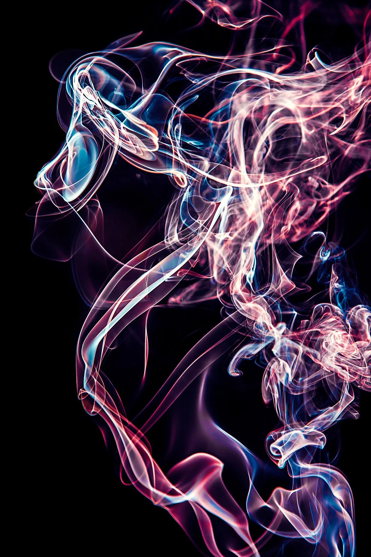 Colorful swirling smoke patterns against a black background.
