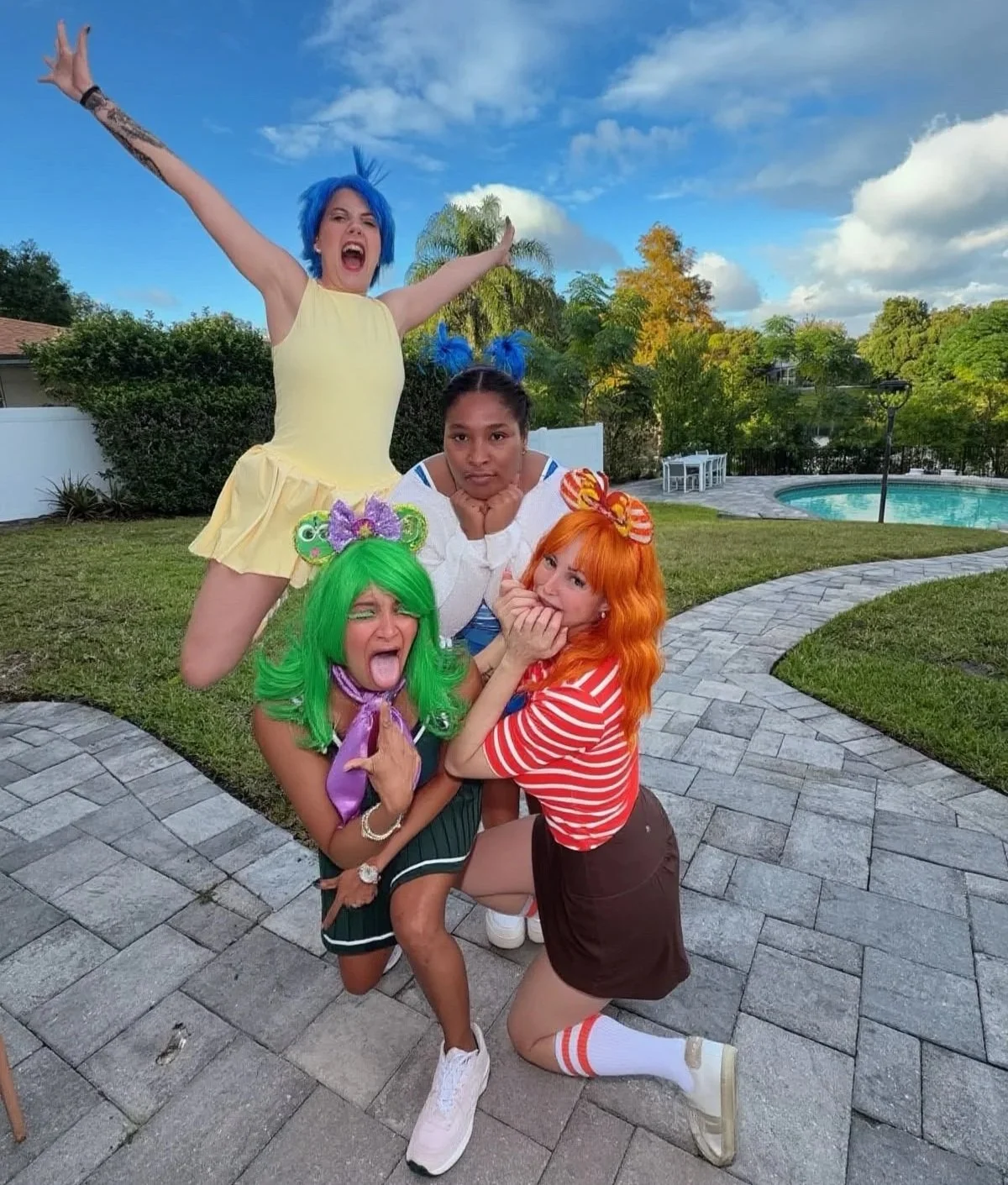 Therapy Cove team dressed as Inside Out emotions Joy, Sadness, Disgust, and Anxiety at Halloween Horror Nights