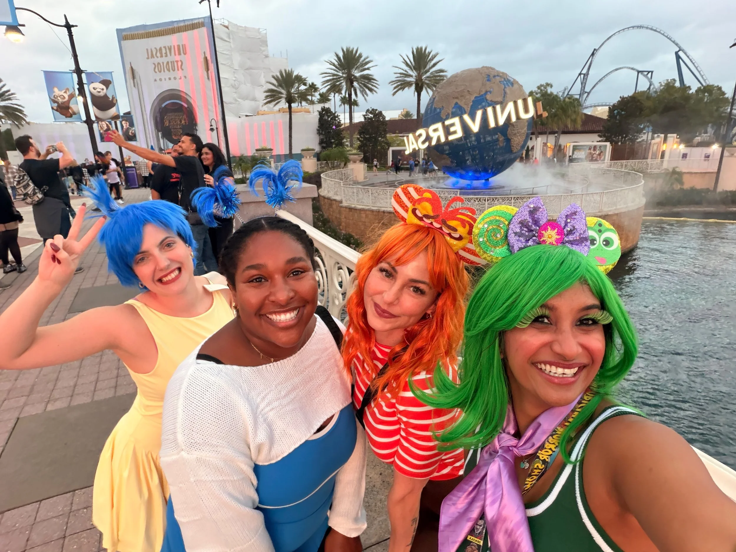 Therapy Cove team dressed as Inside Out emotions Joy, Sadness, Disgust, and Anxiety at Halloween Horror Nights
