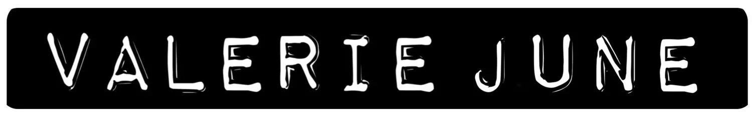 Black rectangular banner with the name 'VALERIE JUNE' in white, stylized, hand-drawn lettering.
