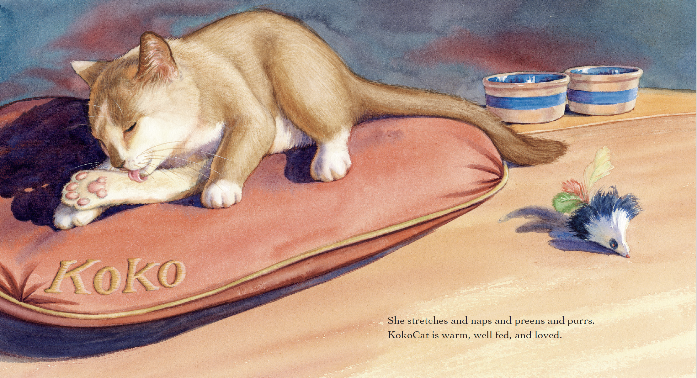A watercolor illustration of a cat named Koko stretching and grooming on a pink cushion with her name embroidered, next to a toy mouse with feathers. There are also two blue-striped bowls behind her.