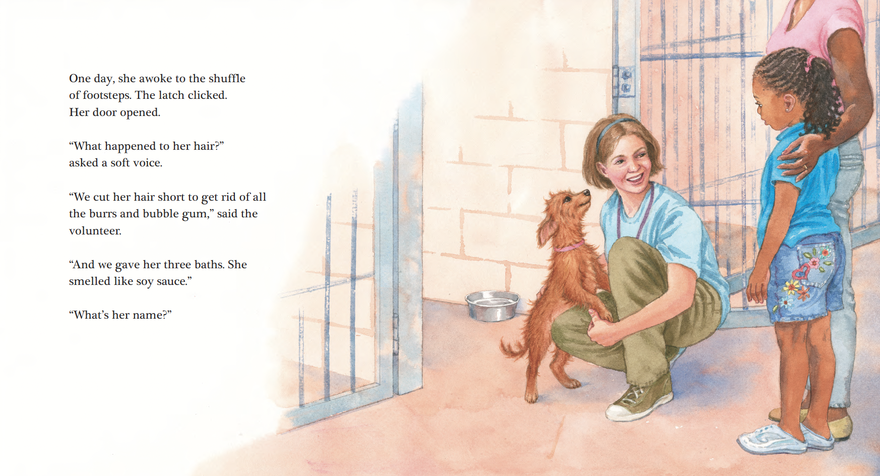 A woman in a blue shirt squatting and holding a small brown puppy, talking to a girl in a blue shirt and colorful shorts, with an adult partially visible nearby. They are at a pet shelter with a metal gate and a water bowl on the floor.