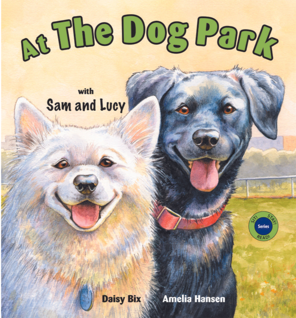 Children's book cover titled 'At The Dog Park' featuring illustrated happy dog and puppy at the park with a fence in the background.