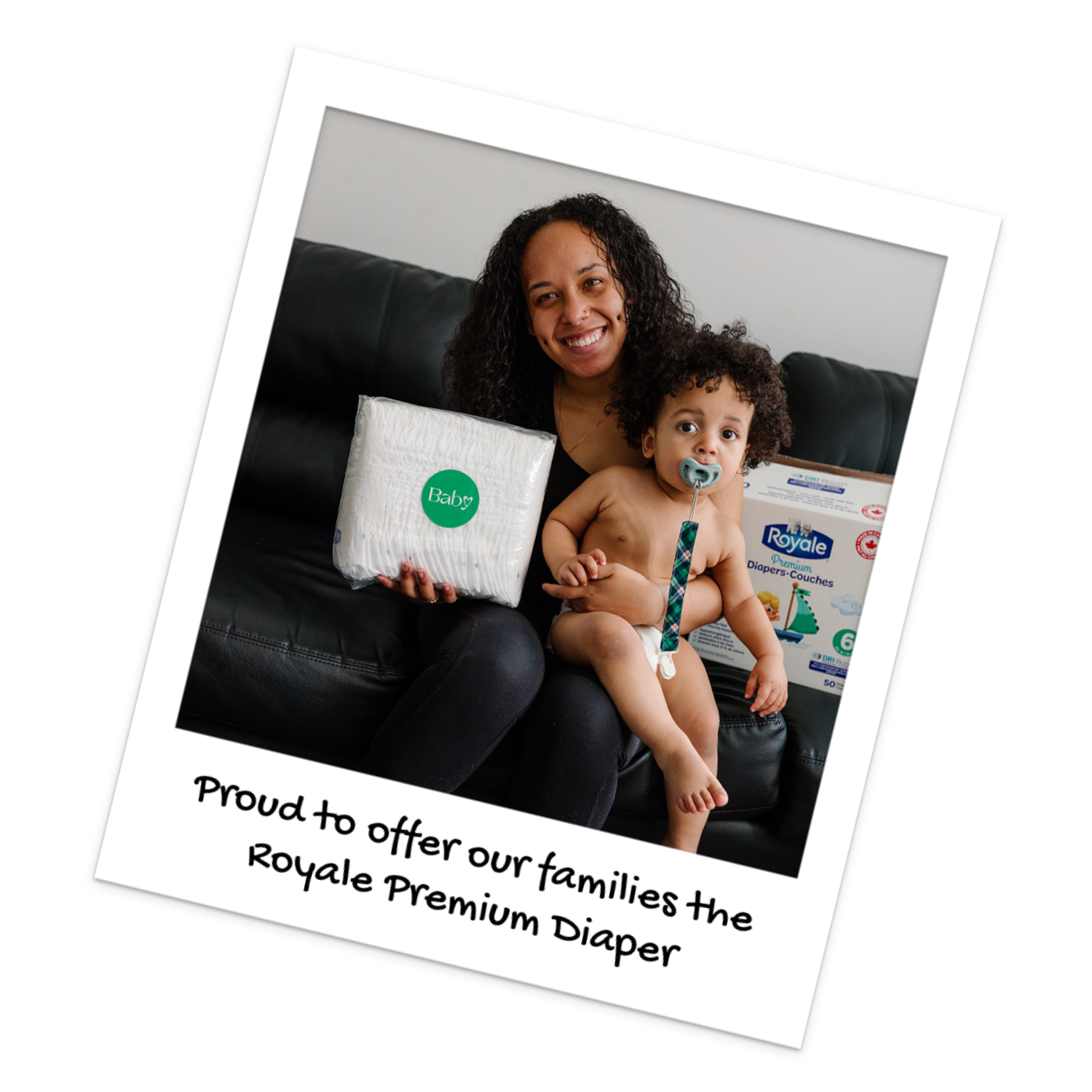 A mom and her baby showcase Royale Premium Diapers, received from Baby Love