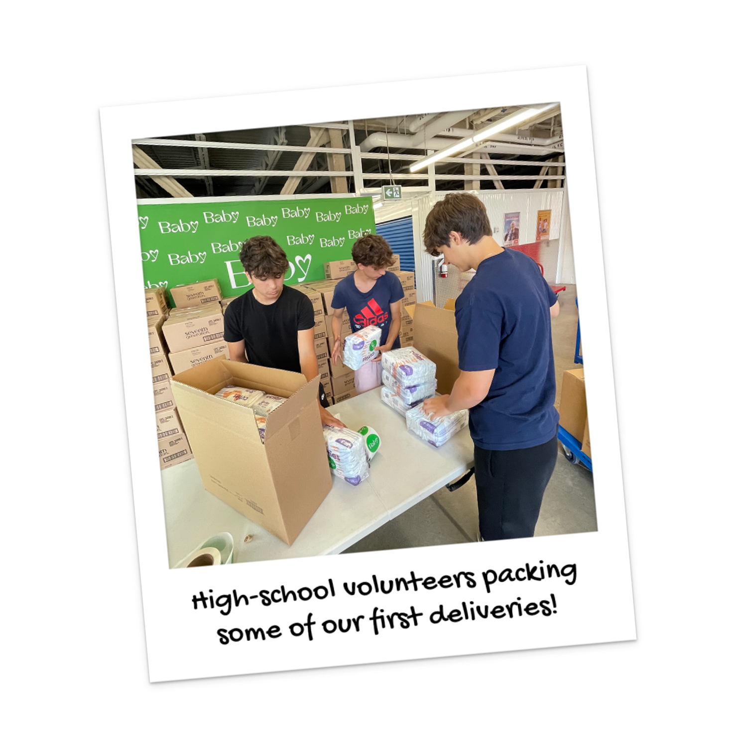 High school volunteers pack some of Baby Love's first deliveries