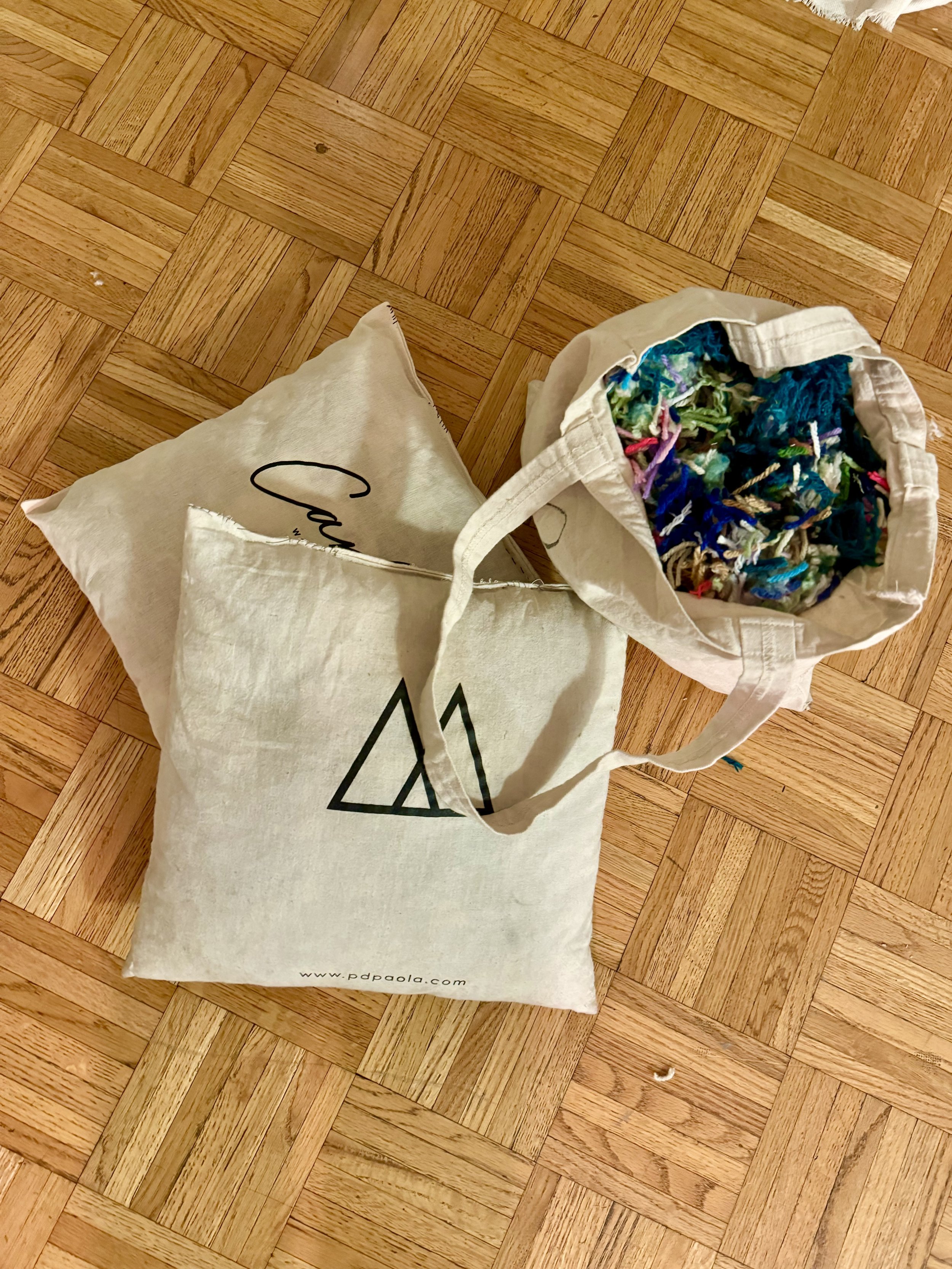 I make pillow inserts out of recycled tote bags and yarn and fabric scraps