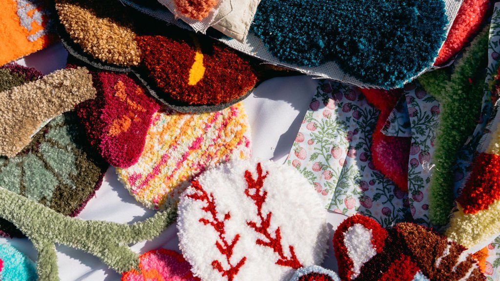 Colorful woven and embroidered fabric and textile samples with various patterns and textures