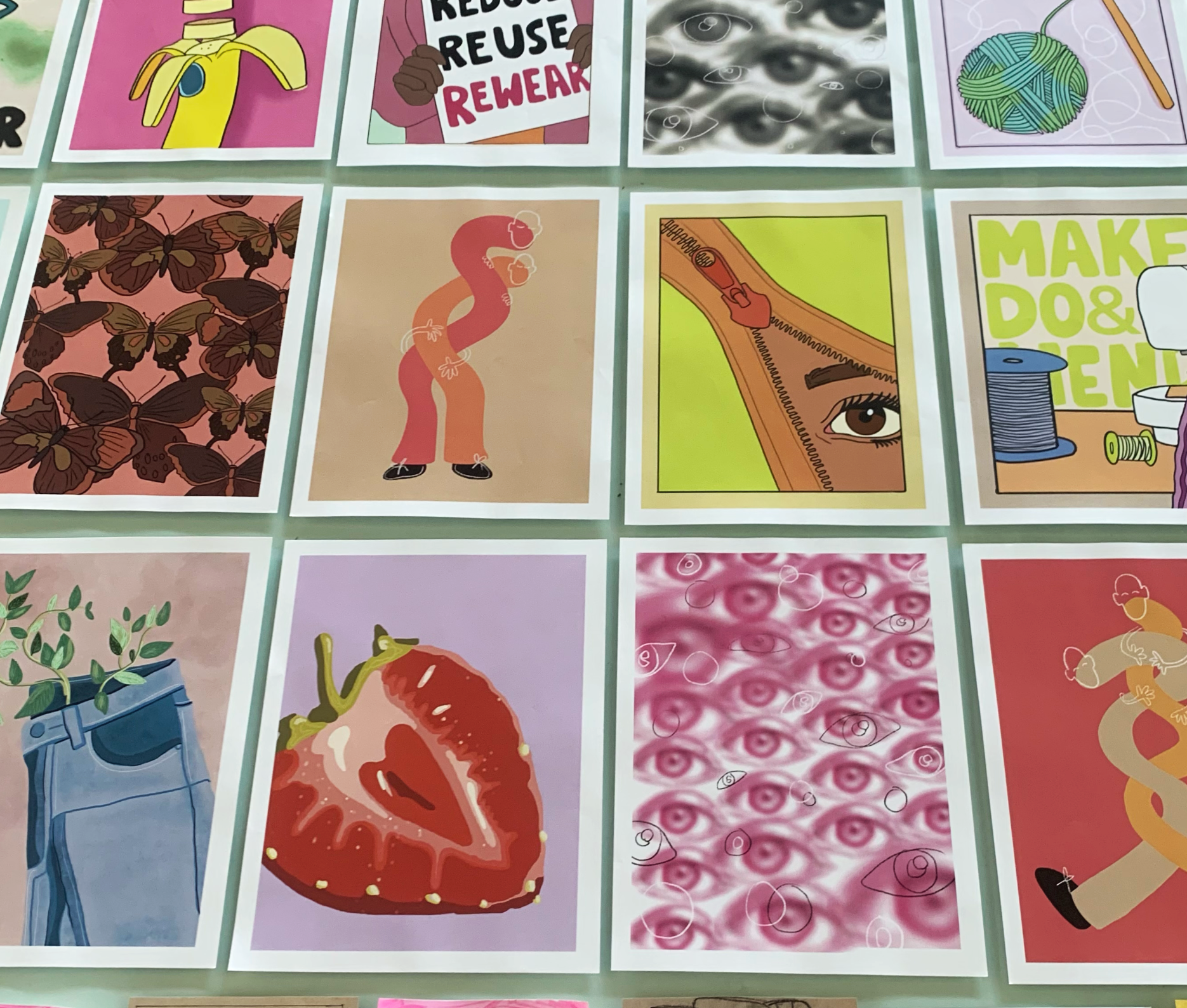 A grid of colorful illustrations including butterflies, a strawberry, a zipper with an eye, a plant in a blue pot, and abstract eye patterns.