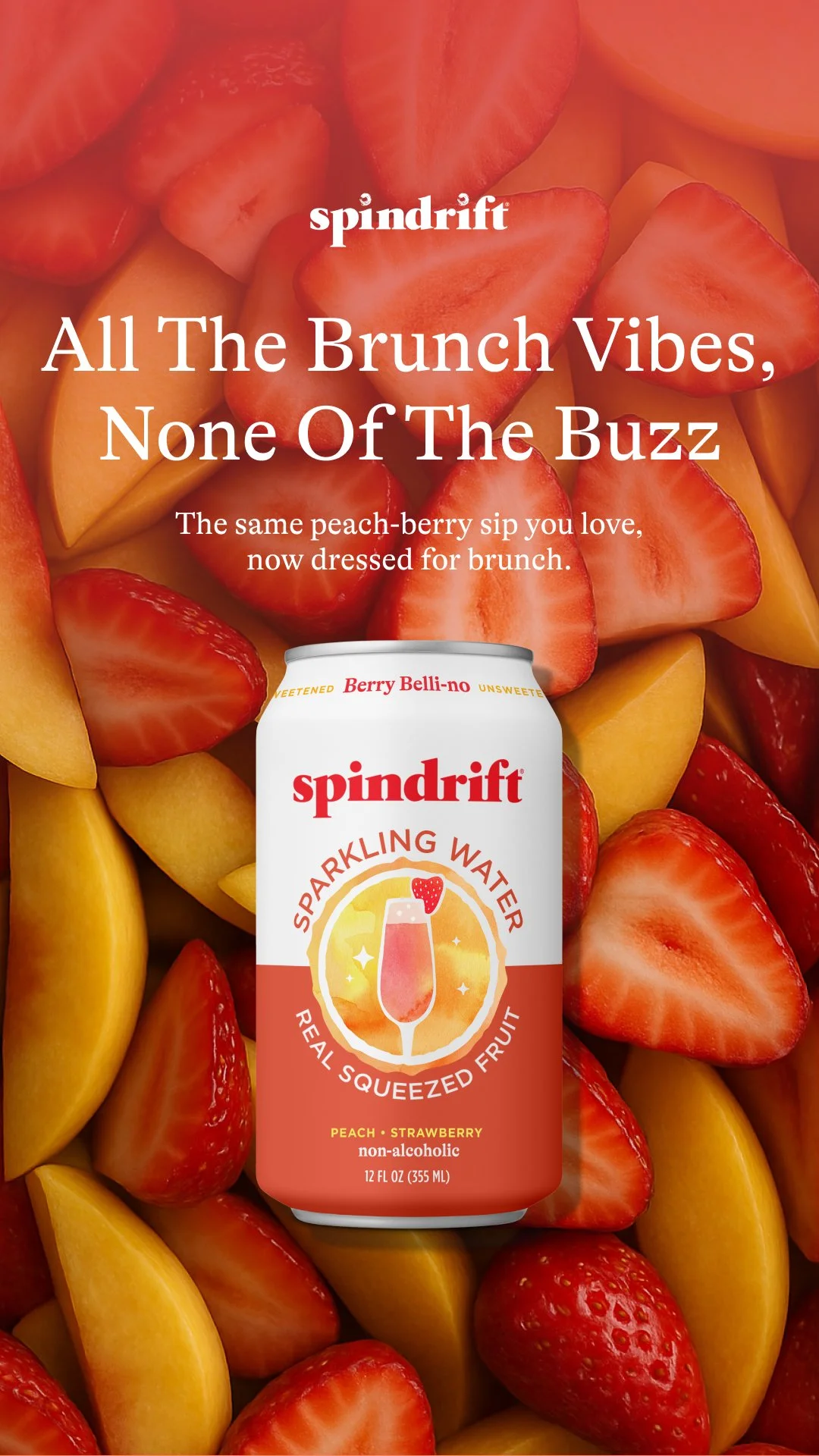 A can of Spindrift sparkling water with peach and strawberry flavor in front of a background of sliced strawberries and peaches.