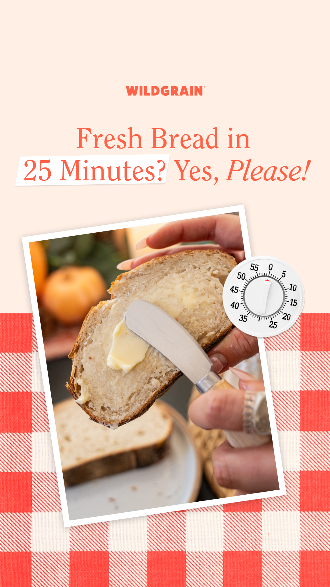 A promotional image for Wildgrain featuring a slice of bread with butter being spread on it, with a kitchen background and a red and white checkered tablecloth at the bottom, along with text advertising fresh bread in 25 minutes.