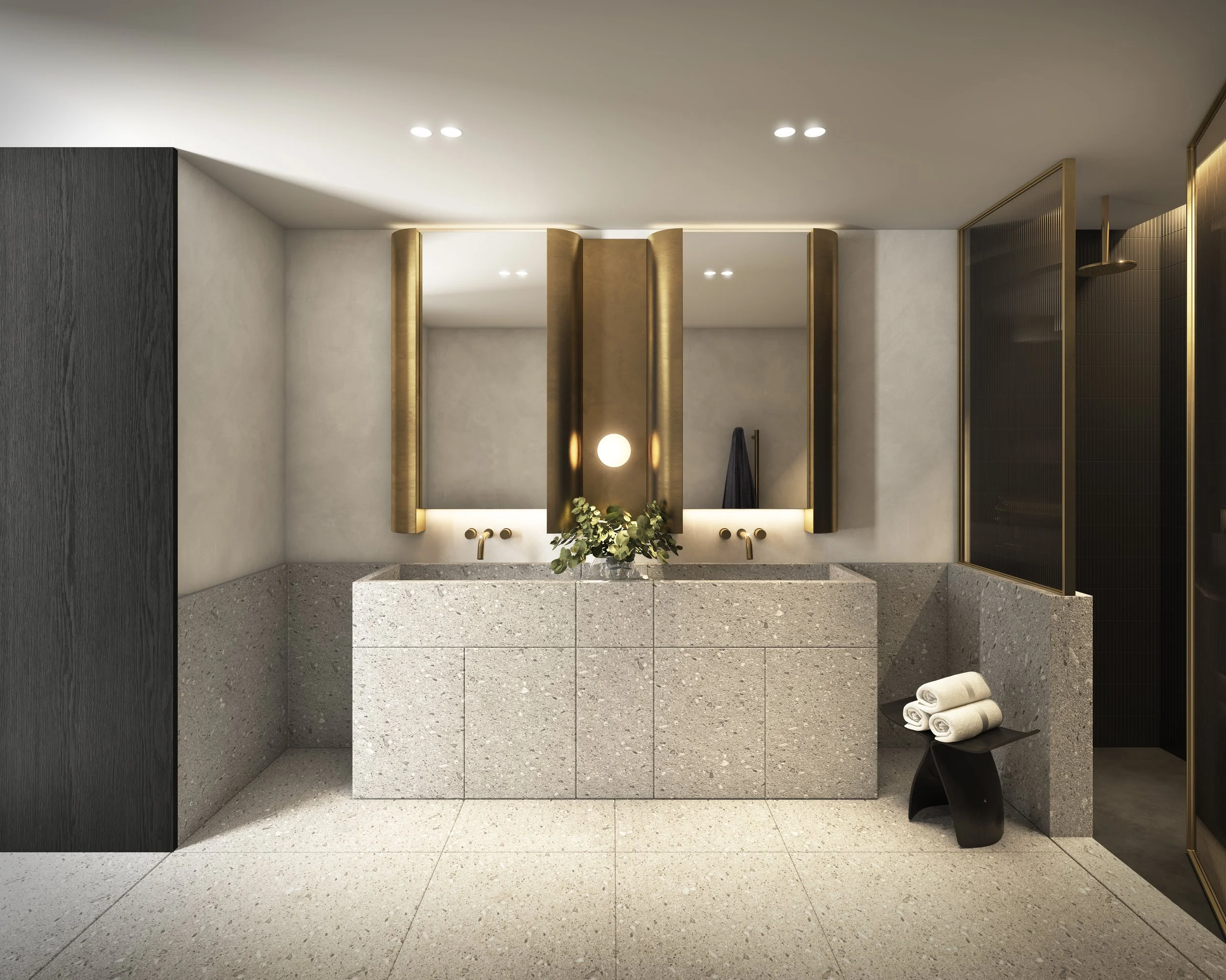 Modern bathroom featuring two sinks with gold fixtures, large mirrors, a black stool with rolled towels, and elegant gold accents.