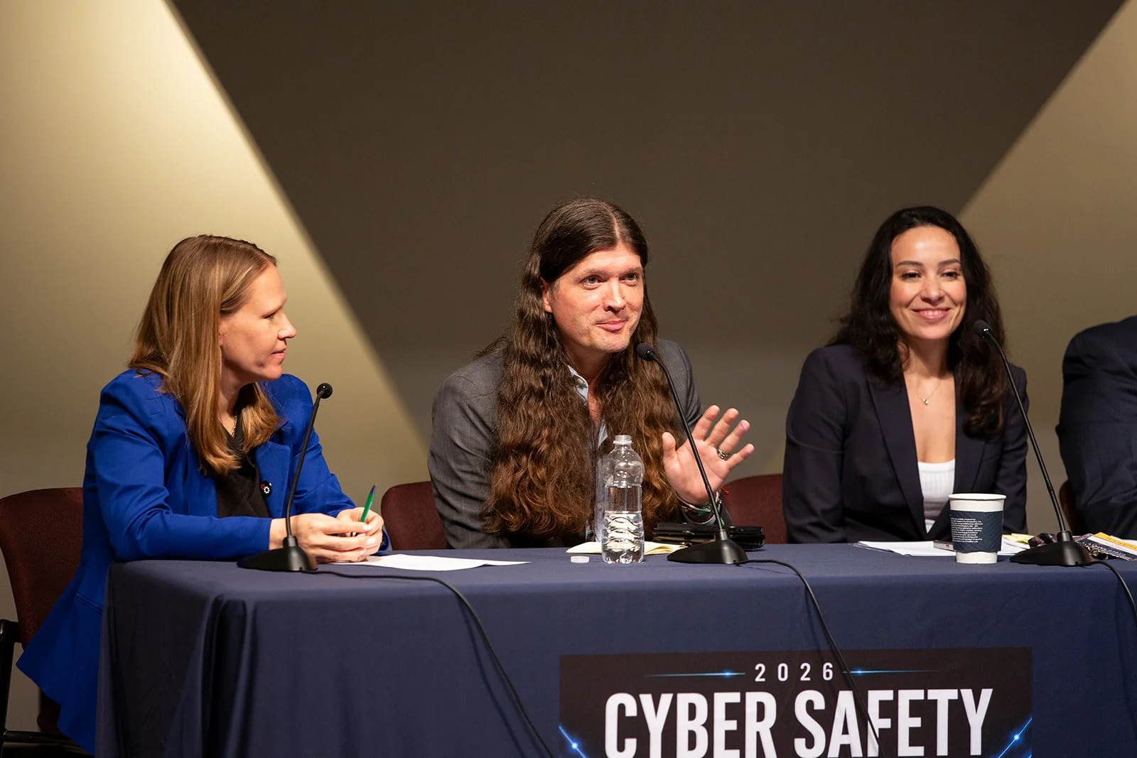 Conference panel discussion photographed by a Washington DC event photographer at the 2026 Cyber Safety Summit, featuring cybersecurity experts speaking on digital security, cyber threats, and online safety during a professional conference.