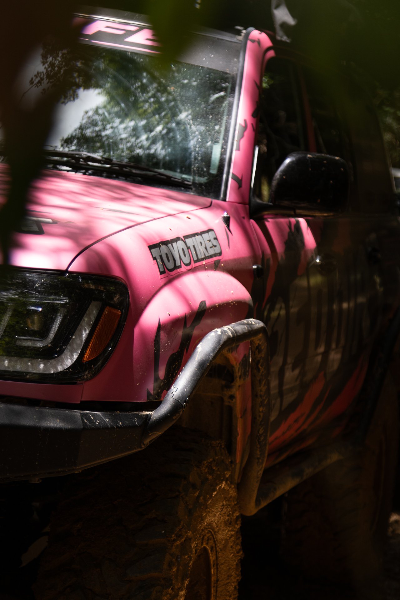 A pink off-road vehicle with a 