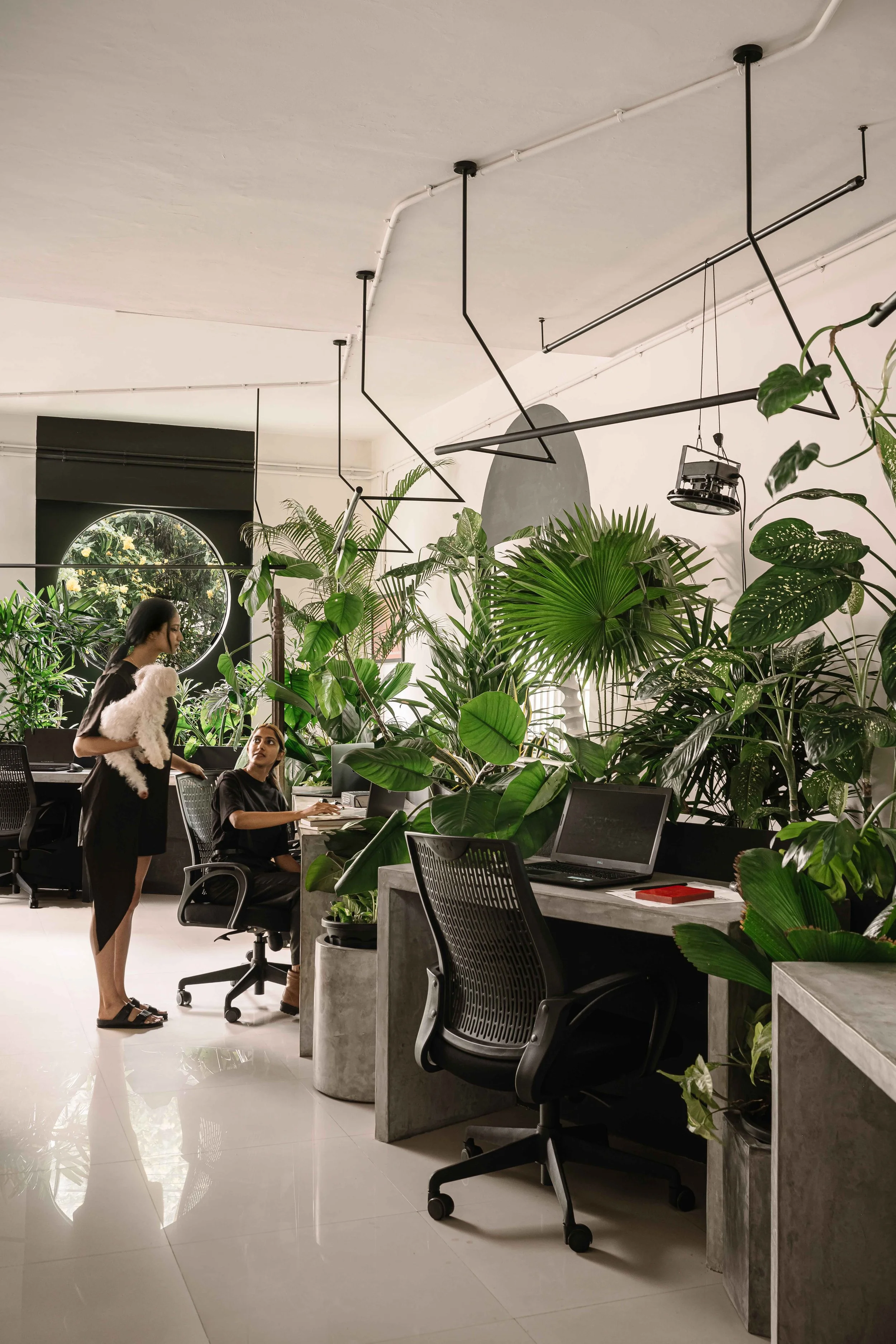 Biophilic open workspace with indoor plants at Second Home office in Kochi