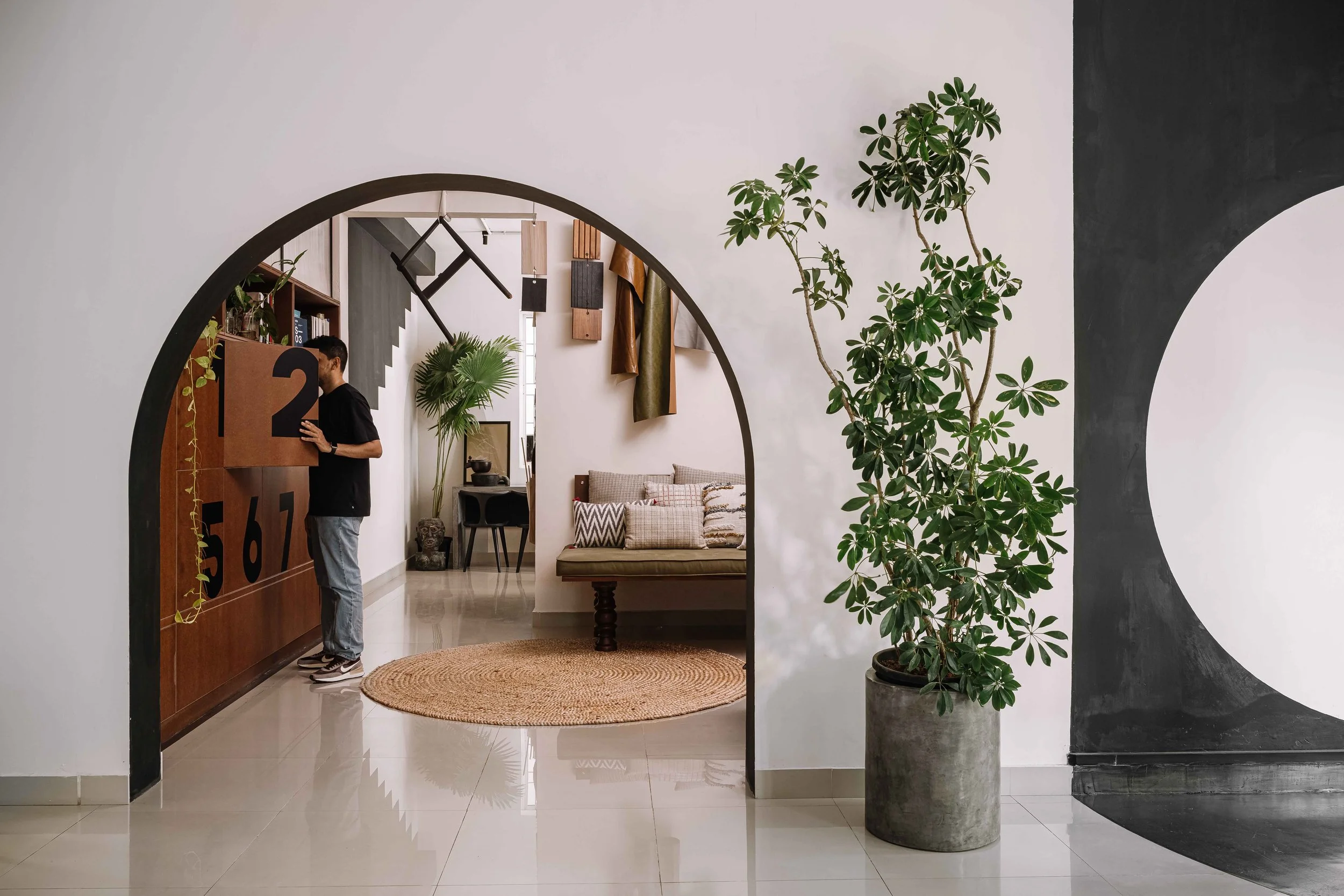 Lounge at Second Home by Workers of Art featuring arched openings, custom seating, and contemporary office design in Kochi, India.