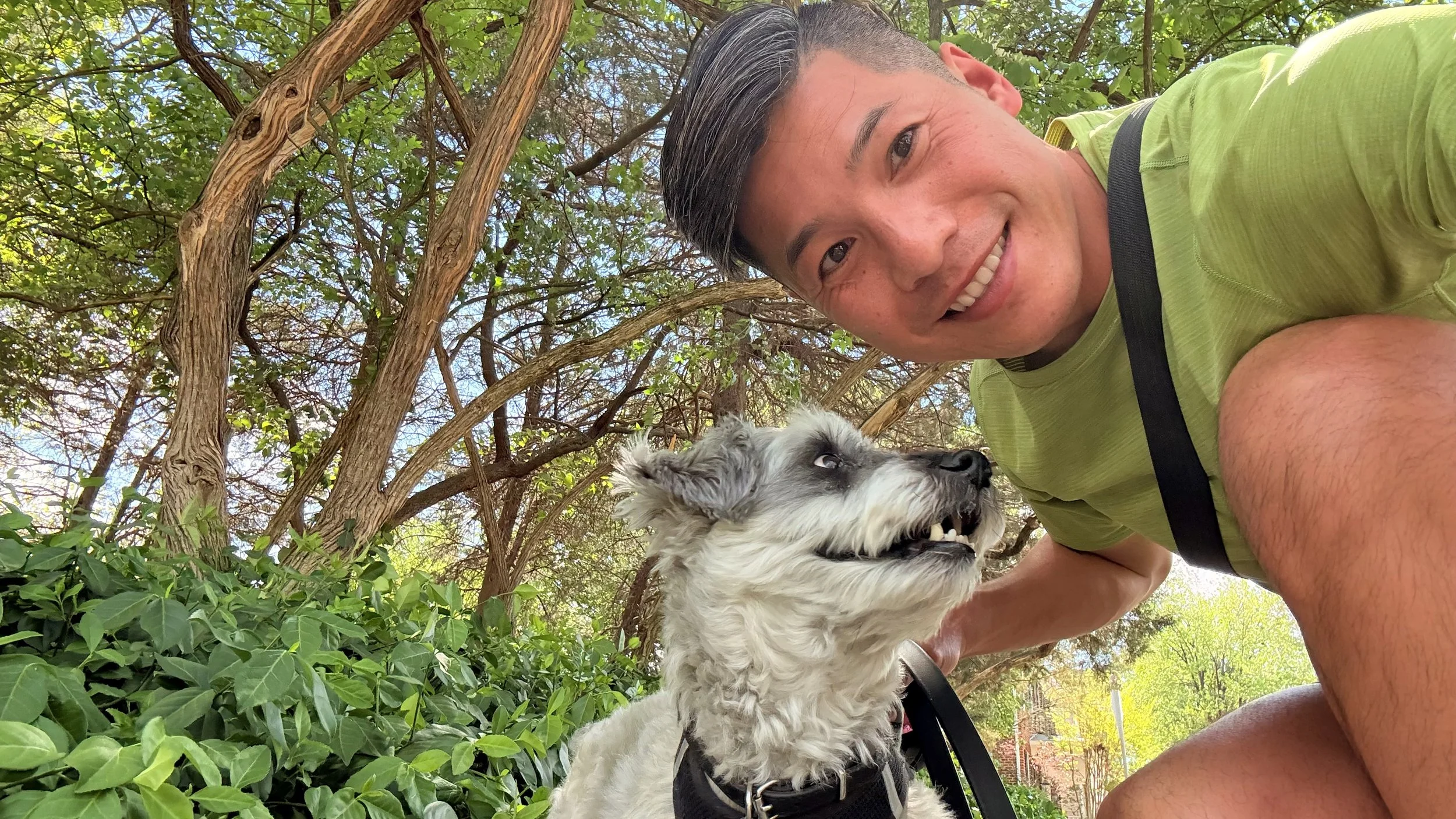 Tucker is smiling with his favorite dog walker during his 15-minute walk around the neighborhood of Gaithersburg, MD. 