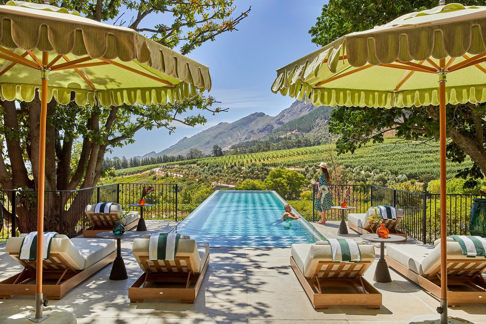 Franschhoek House at La Residence_Pool with Couple_1_GregCox.jpg