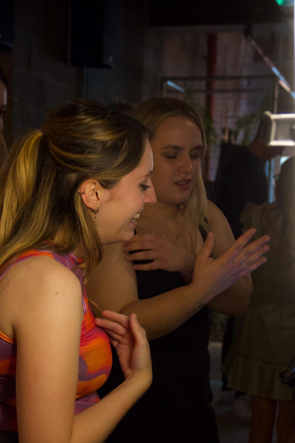 Two girls at a competitive socialising venue