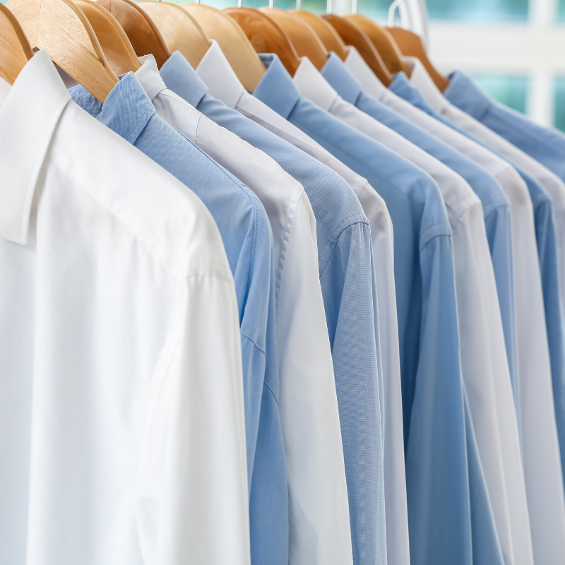 A rack of business shirts laundered and ironed.