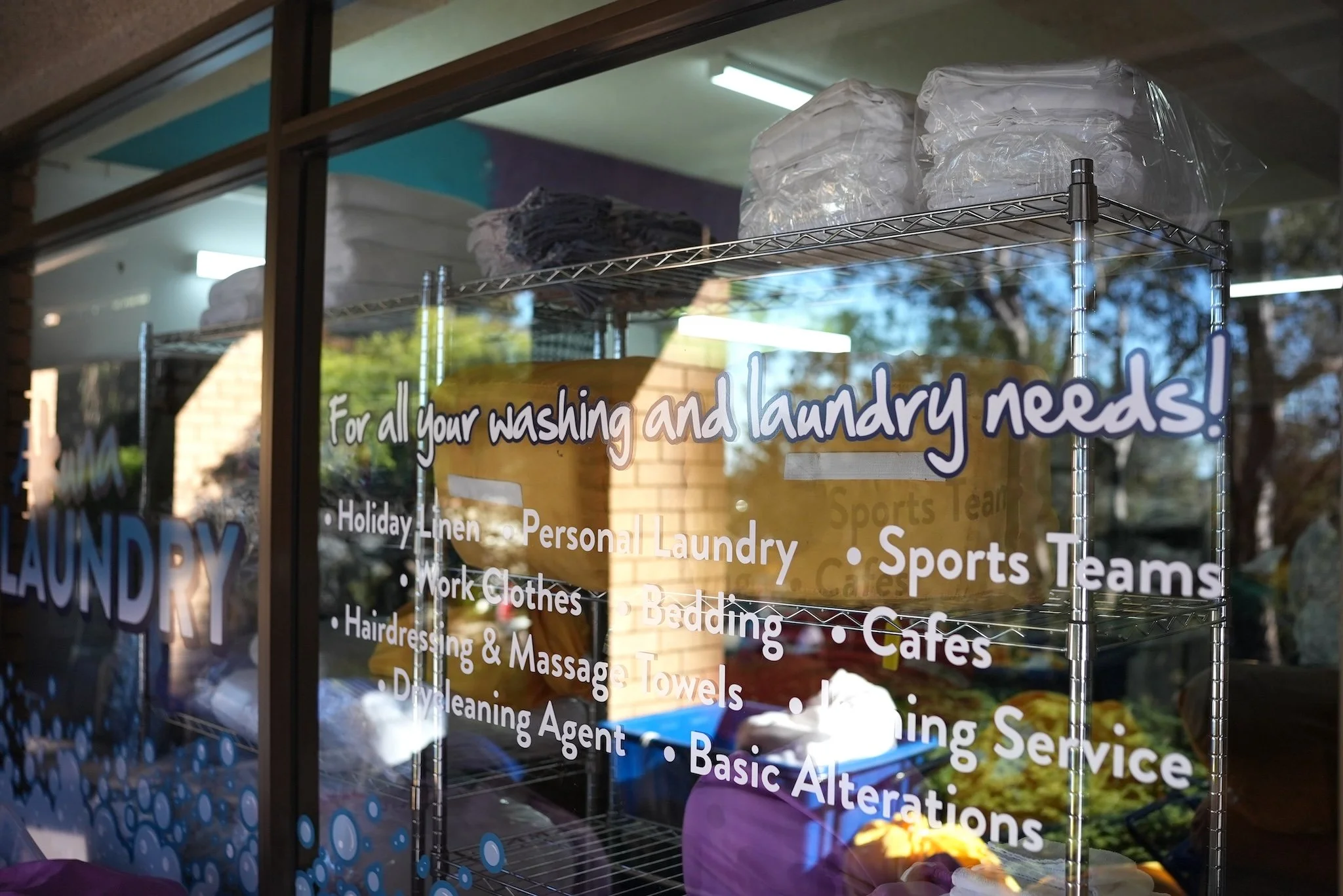 front window of Akuna Laundry