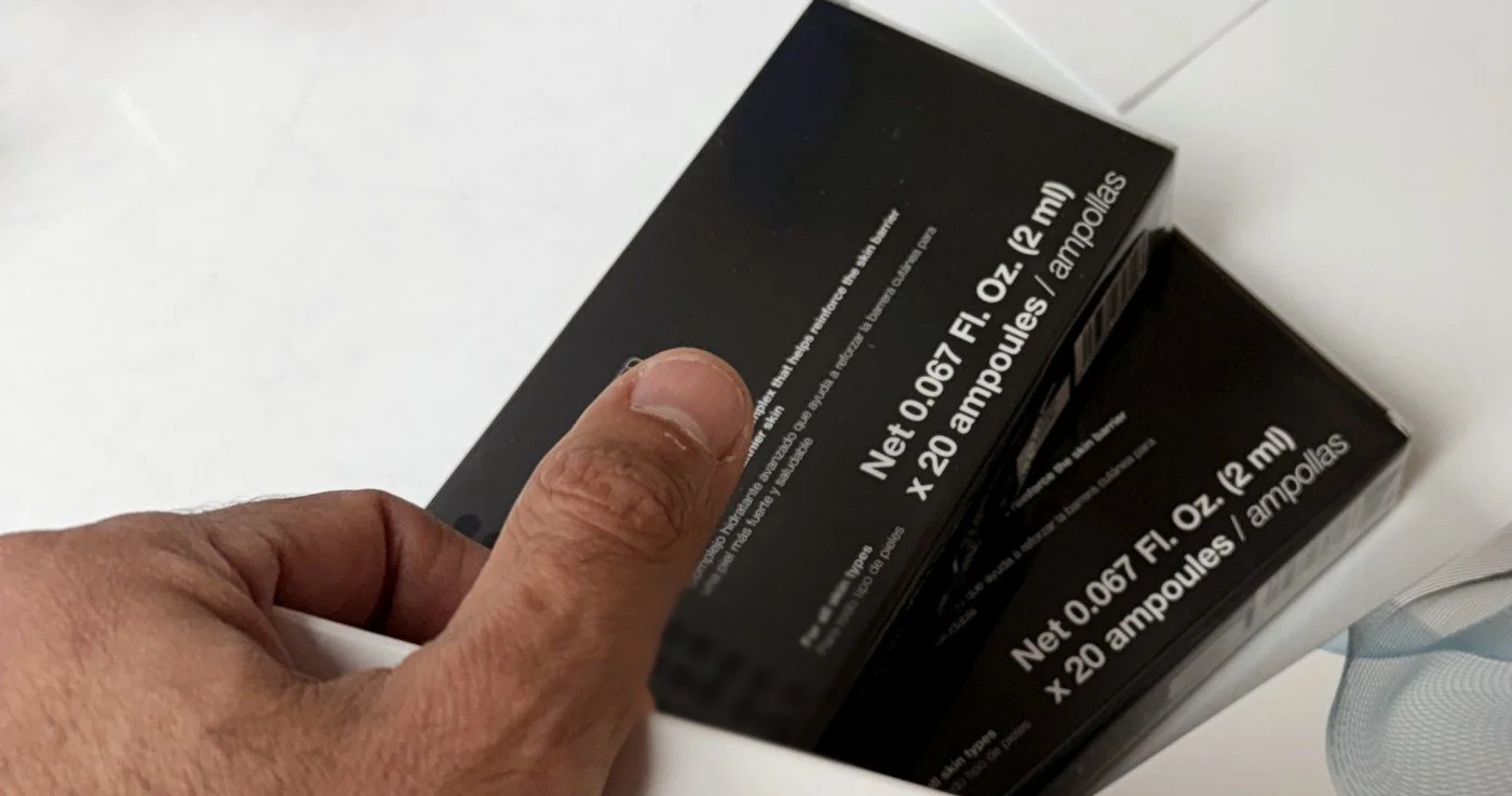 A Connection Group team member handling client product by hand
