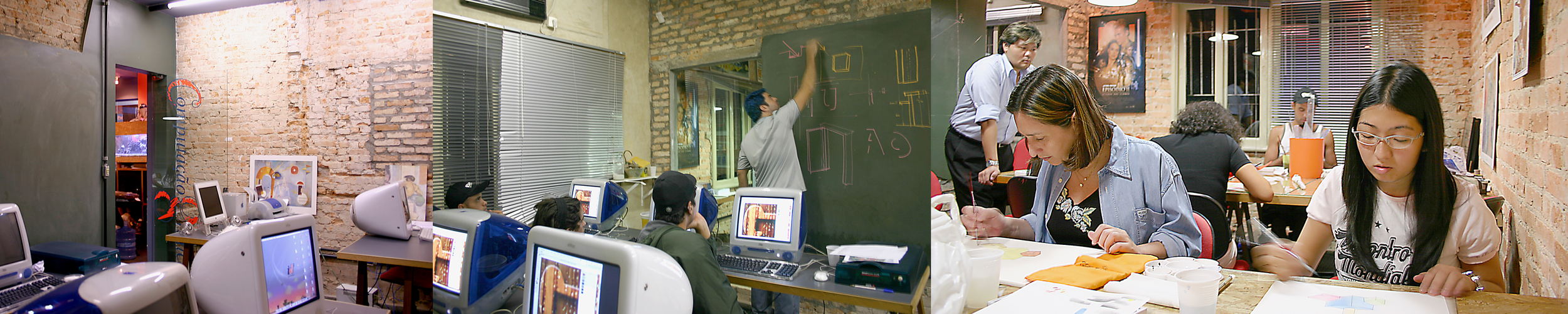A classroom with students working on computers and a teacher writing on a chalkboard.